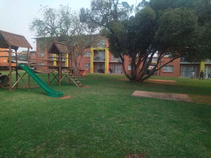 For Sale: Apartment in Montana with two bedrooms, carports, and outdoor braai area.