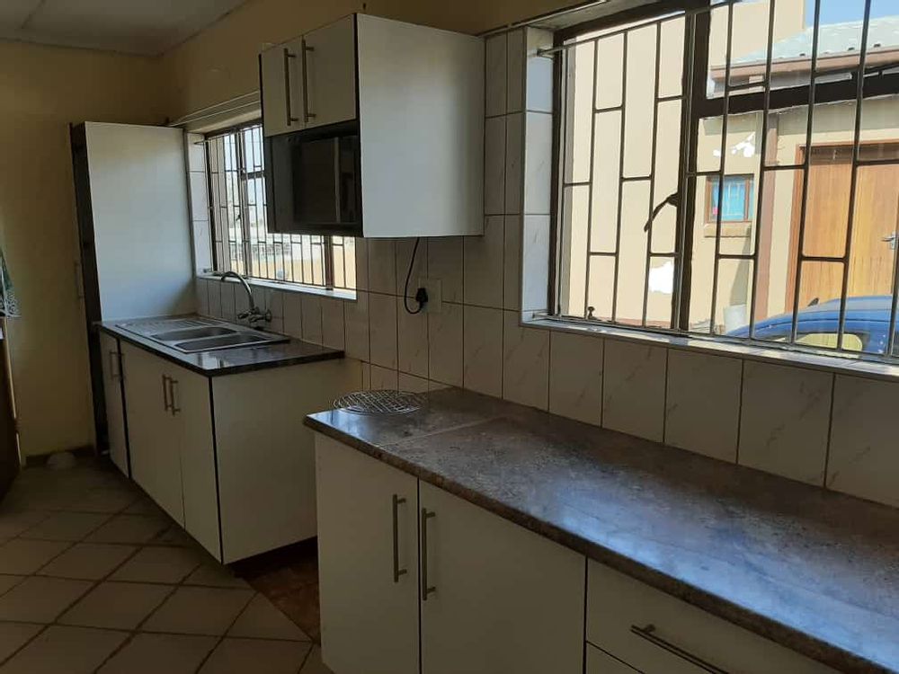 Kitchen Cupboard and sink.