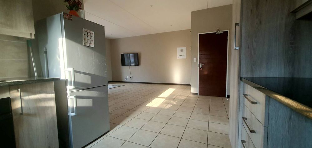 Kitchen fridge and stove view