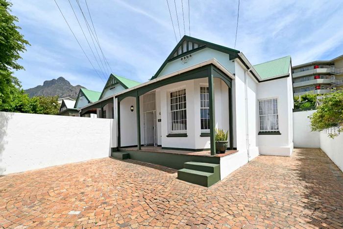 Mowbray House For Sale: Three Victorian homes, strong rental income, secure parking.