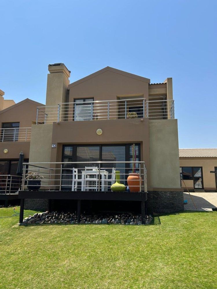 Front with wooden balcony - doors opening from the living area