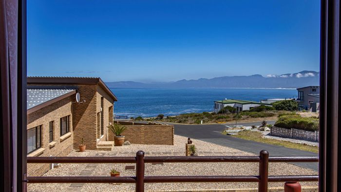 For Sale: House in De Kelders with ocean view, flatlet, and spacious layout.