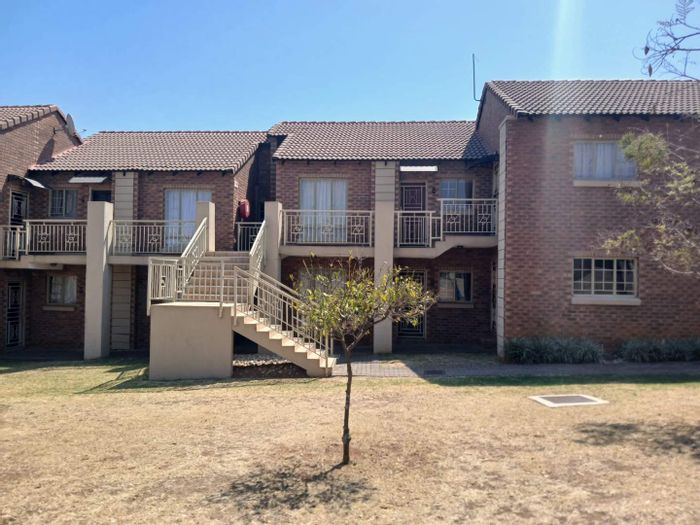 Mooikloof Ridge Apartment For Sale: Ground floor, private garden, spacious living areas.