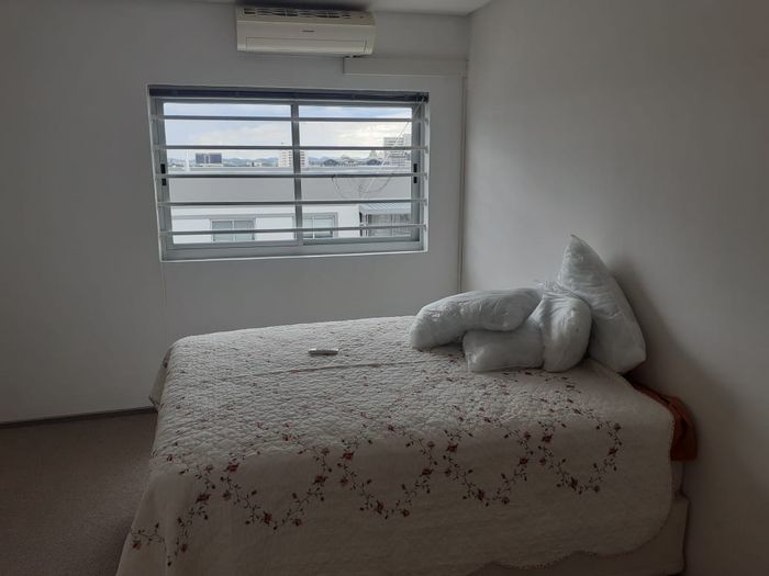 Penthouse for Sale in Windhoek Central: 2 beds, en-suites, balcony, pool access.