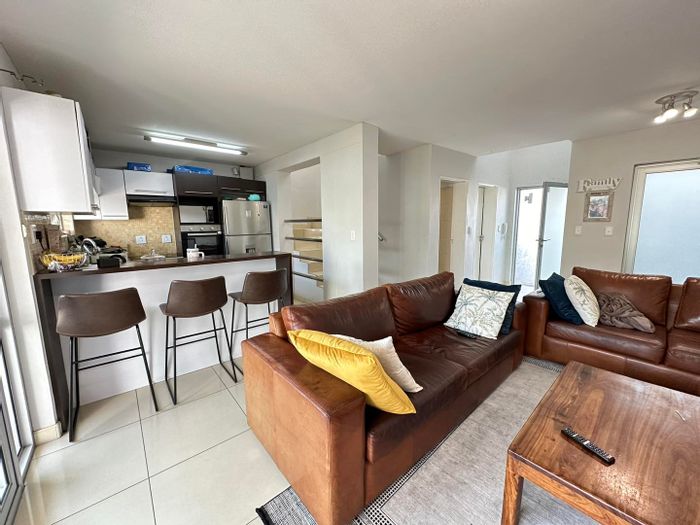 Kleine Kuppe Townhouse For Sale: Open-plan living, private balconies, BBQ area, garage.