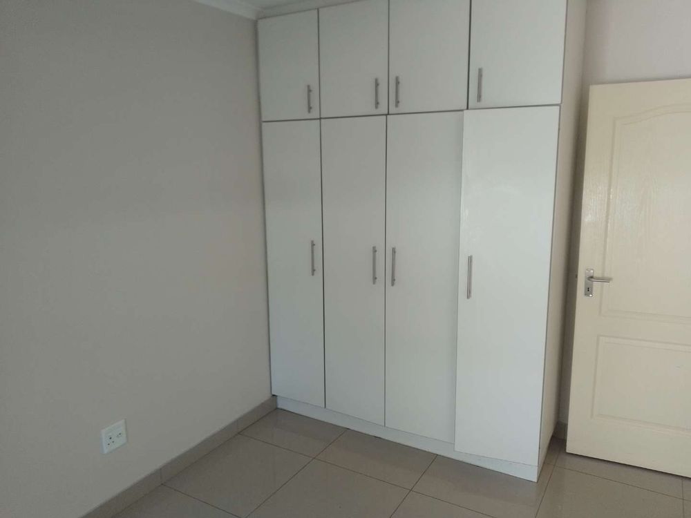 General view of the build in cupboards found in the second bedroom. 