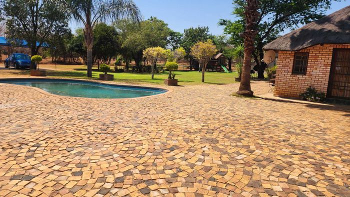 Rustenburg Central House For Sale: Multiple homes, garages, swimming pool, and storage options.