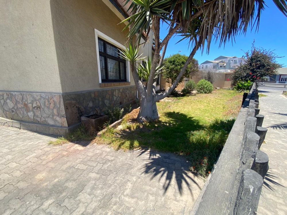 Front courtyard and side garden