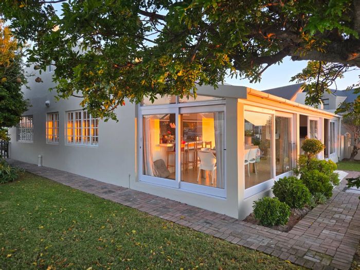 House for Sale in Grotto Bay Central: 3 beds, secure estate, garden, beach access.