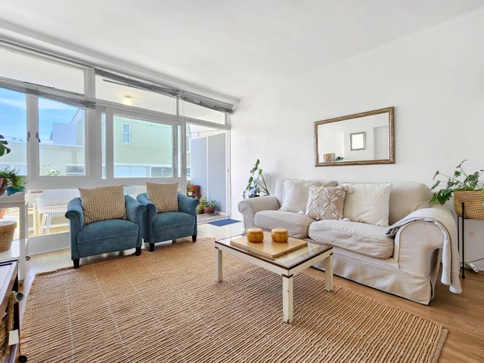 Furnished Sea Point apartment with balcony, garage, and cleaning service included. To Rent.