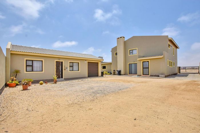 Spacious 5-bedroom house with flat, garages, and multiple living areas in Swakopmund Ext 9. For Sale.