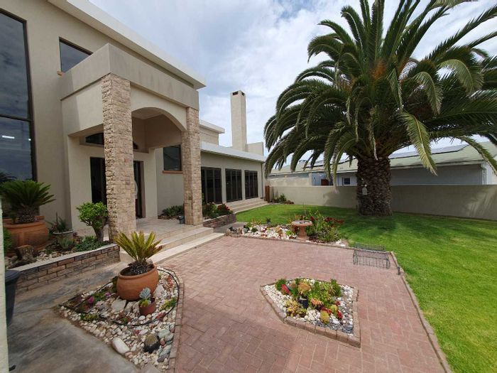 For Sale: Spacious House in Henties Bay Central with garden, flat, and solar power.