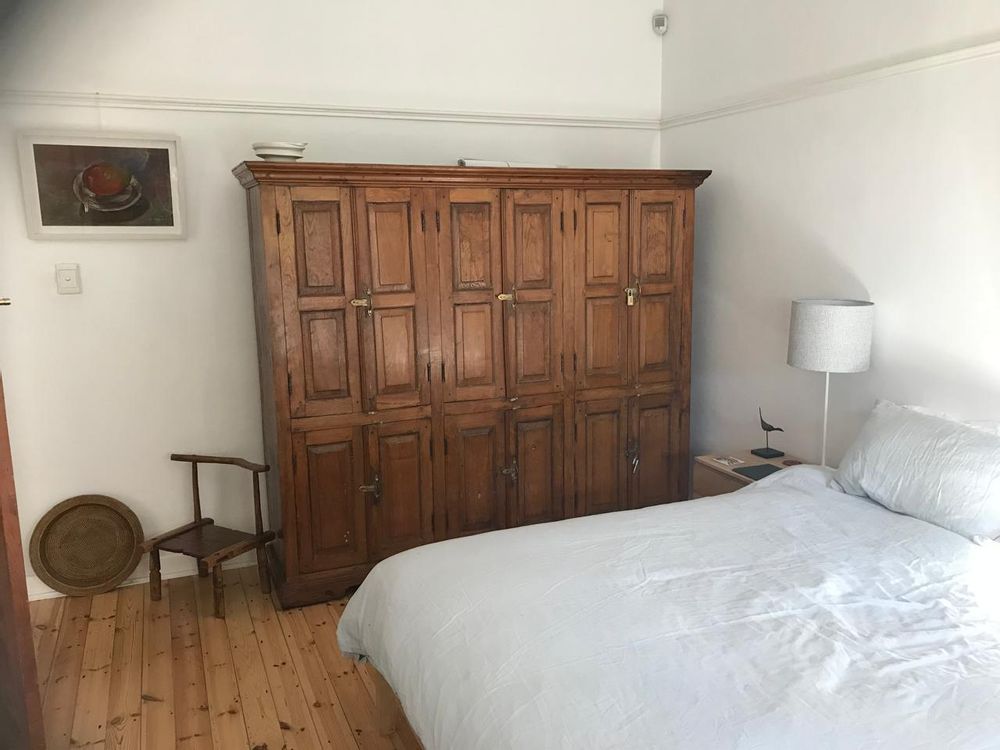 Main bedroom featuring beautiful wooden floors 