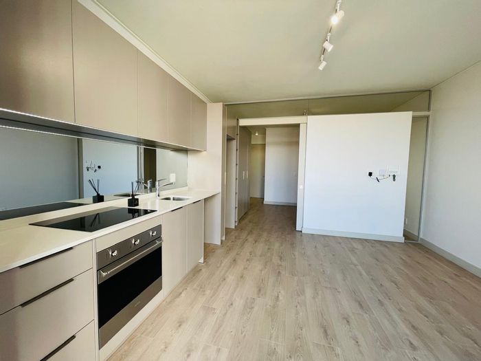 1-Bedroom Apartment To Rent in Rosebank with gym, pool, and skybar amenities.