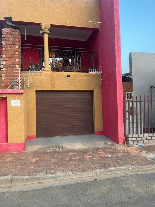 For Sale: Khomasdal House with 3 Bedrooms, Rental Flats, Garage, and Security Features.