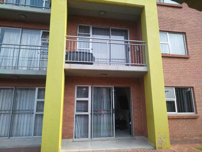 For Sale: Apartment in Montana with two bedrooms, carports, and outdoor braai area.