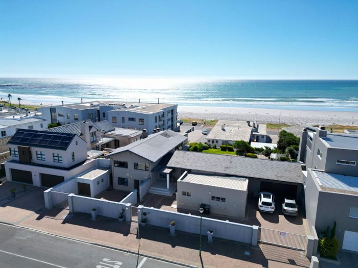 For Sale: Versatile House in Melkbosstrand Central with dual living and guesthouse potential.