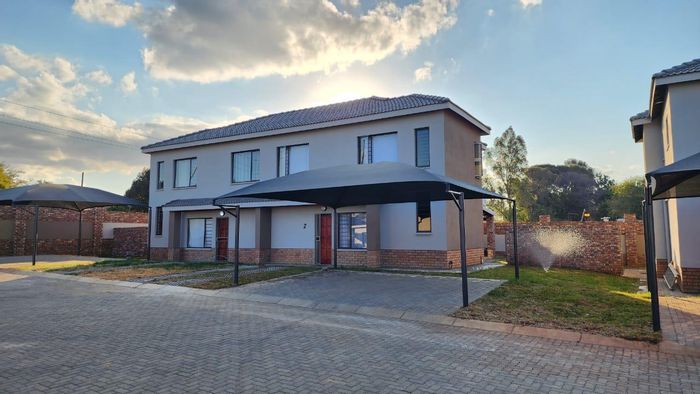 3-Bedroom Townhouse For Sale in Waterfall East with open-plan living and carports.