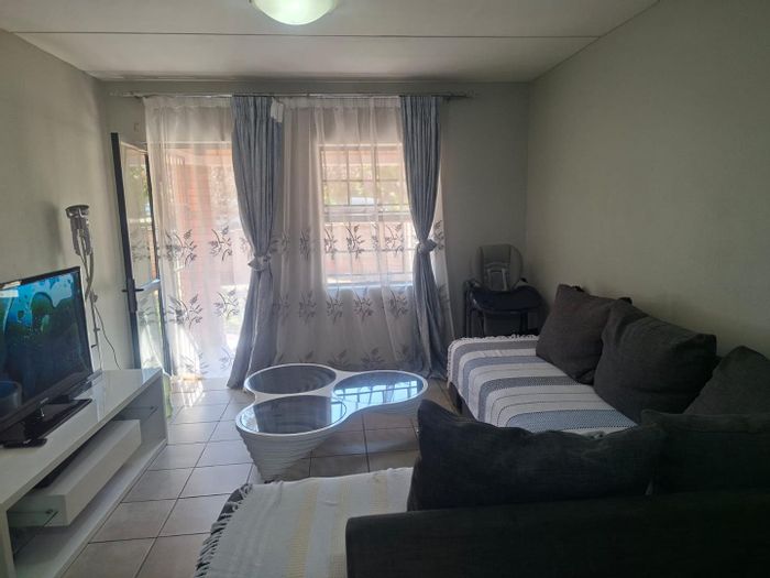 For Sale: Apartment in Montana Tuine with private garden, pools, and 24-hour security.