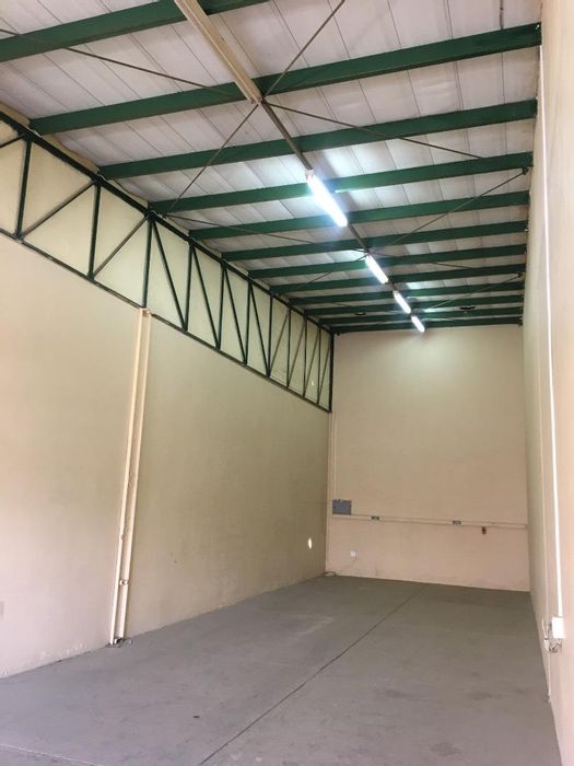 Industrial Warehouse To Rent in Southern Industrial Area with parking and roll-up door.