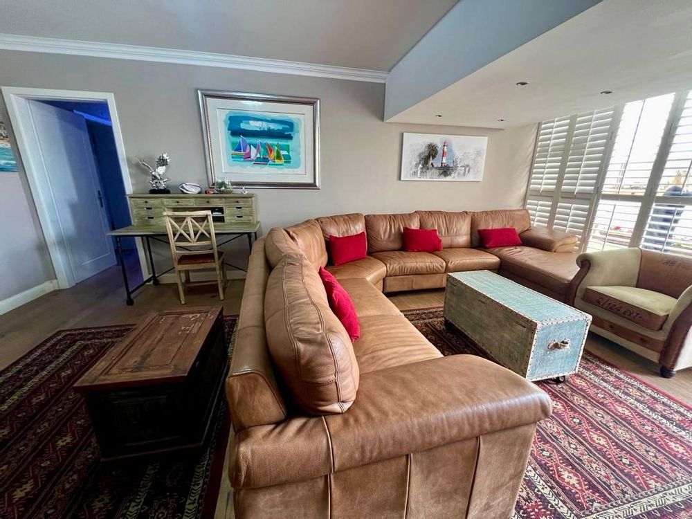 Lounge and the hallway leading to the bedrooms on the left