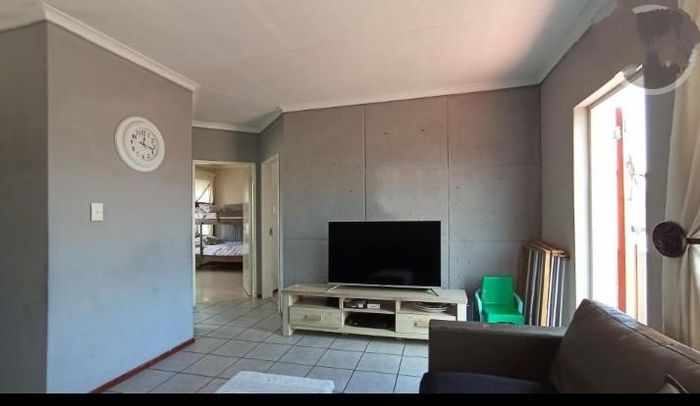 For Sale: Townhouse in Mondeor with 2 beds, garage, near schools and shops.