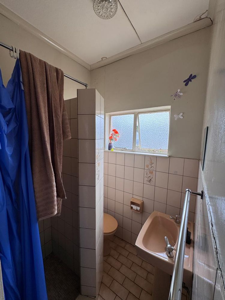 En suite bathroom. Shower and toilet.