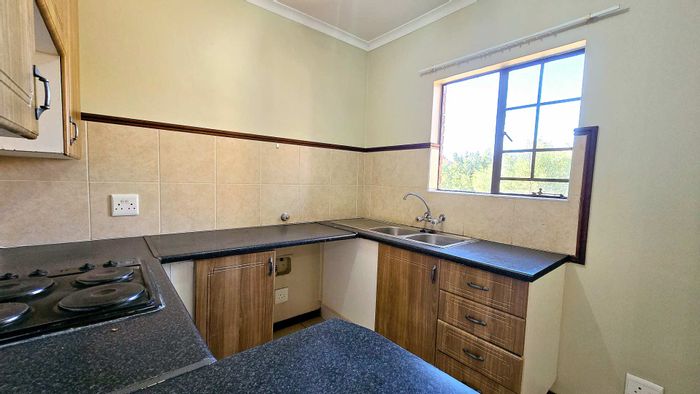 For Sale: 2-Bedroom Apartment in Mooikloof Ridge with pool, tennis court, and security.