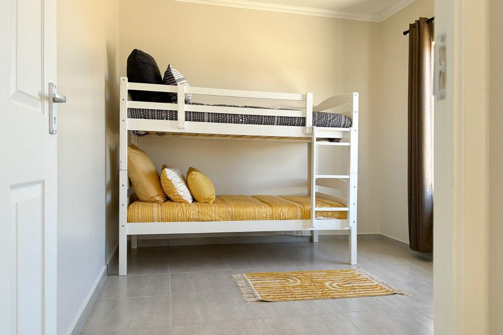 Second bedroom with built-in cupboards.