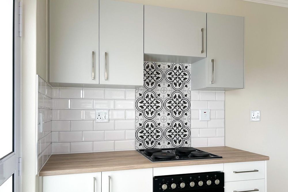 Modern kitchen with built-in cupboards and built-in oven.