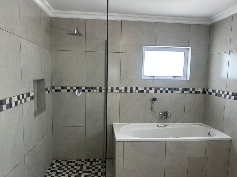 Onsuite bathroom with bath and shower