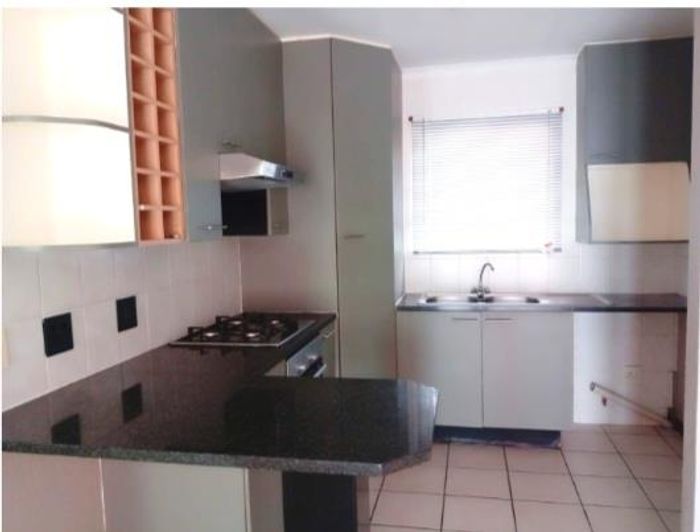2-Bedroom Apartment To Rent in Bedfordview Central with balcony, pool access, and parking.