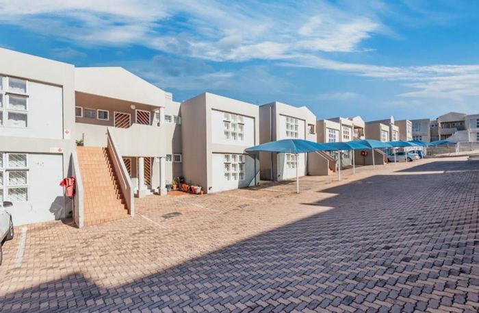 For Sale: Oakdene Townhouse with balcony, carport, pool, and 24hr security.