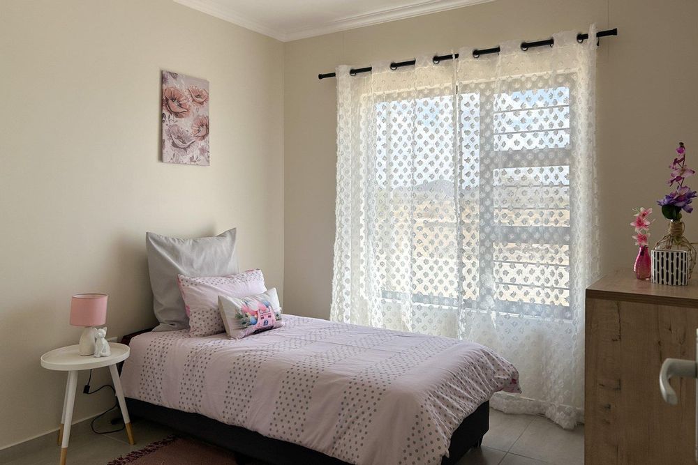 Third bedroom with built-in cupboards.