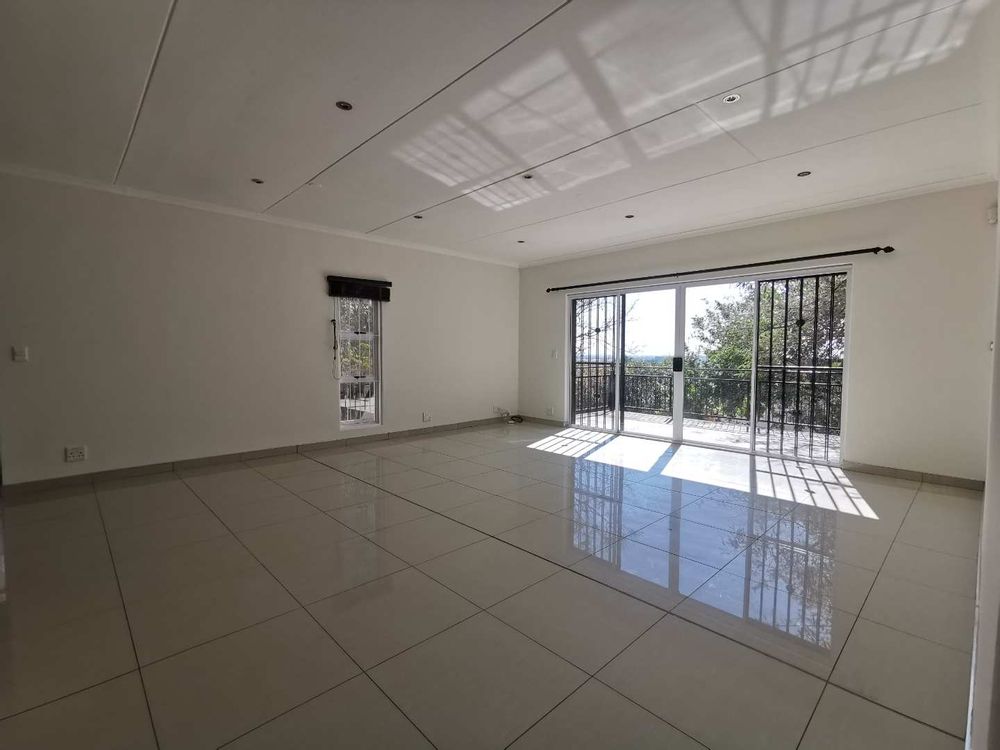 LIVING AREA WITH BALCONY - NORTH VIEWS - TOP FLOOR 