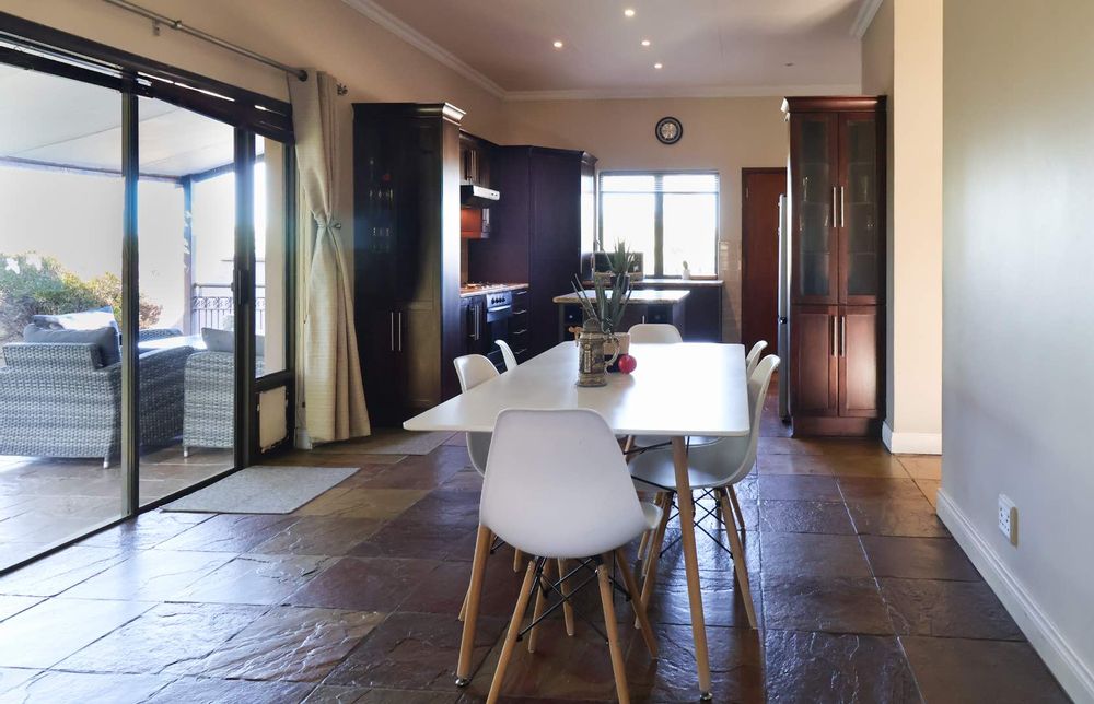 Close-up of dining area with sliding doors to patio