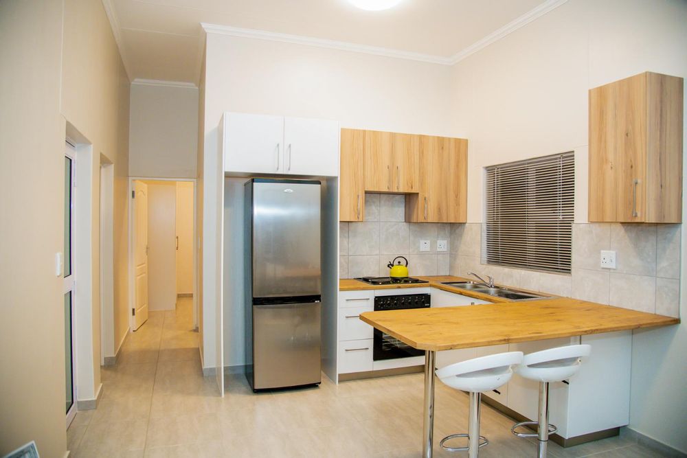 Kitchen with built-in cupboards & oven