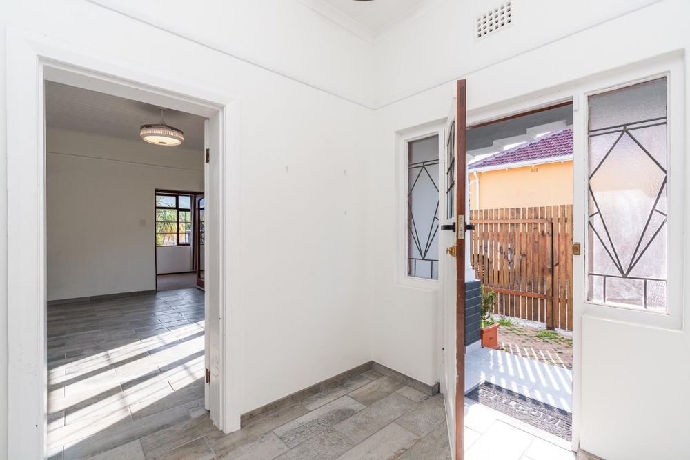 Front door and lounge to the left