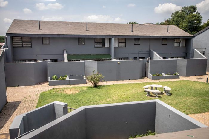 3-Bedroom Townhouse For Sale in Sasolburg Central with garage and communal spaces.