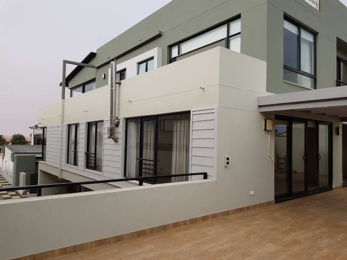 For Sale: Spacious 3-bedroom apartment in Swakopmund Central with garage and terrace.