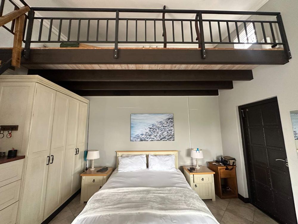 bachelor flat bedroom area with loft space 