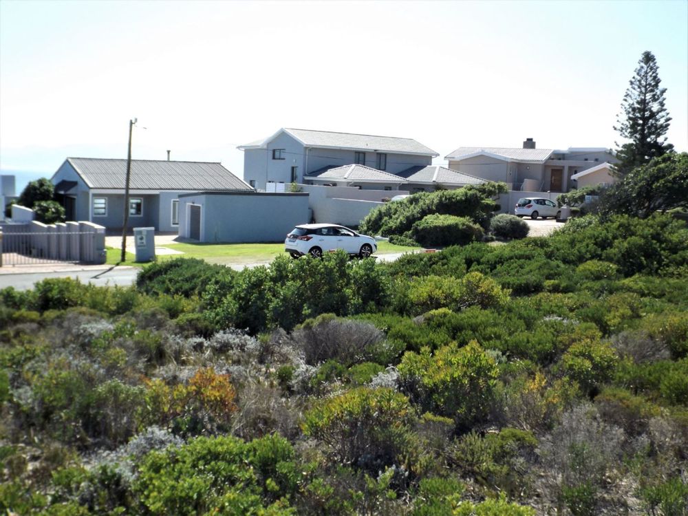 View slightly to our right; 2 up-market double storey Houses.