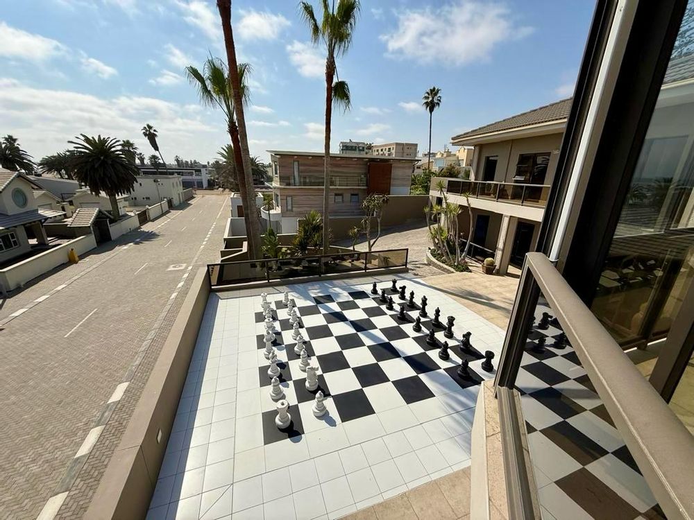 Enclosed balcony with BBQ and sea view. Man-sized chessboard on second floor