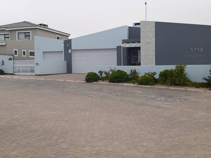 House with flat, 3 garages, and secure courtyard in Henties Bay Central For Sale.