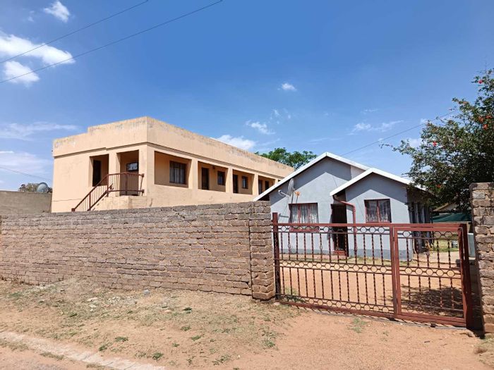 For Sale: House in Kagiso Ext 11 with 12 rental units, near amenities.