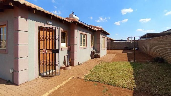 For Sale: 3-bedroom house in Klerksoord AH with secure carport and low-maintenance yard.
