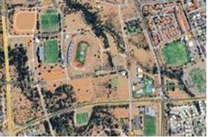 Mixed Use Property For Sale in Olympia: Vacant Sports Ground with Multiple Lots Available.