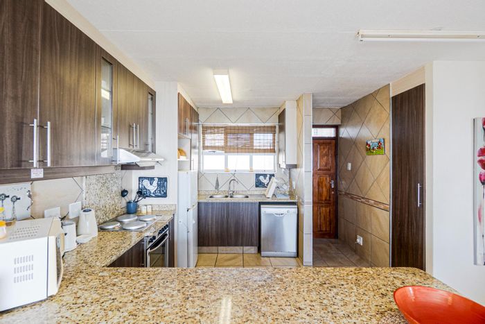 Amanzimtoti Apartment For Sale: Beach access, pools, security, and investment potential.