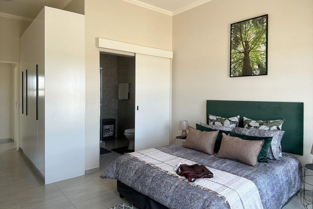 Main bedroom with plenty of built-in cupboards and ensuite bathroom.