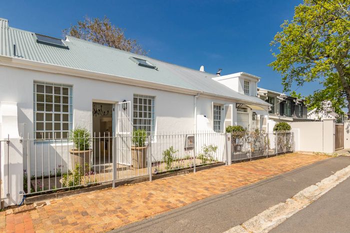 Newlands House For Sale: One-bedroom cottage with patio, pool, and off-street parking.